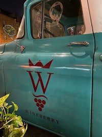 a blue truck with a crown on it